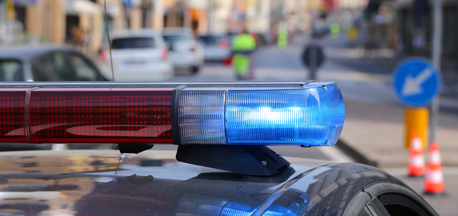 A police car at the scene of a juvenile crime.