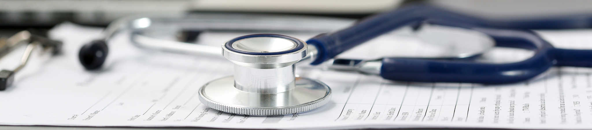 A stethoscope rests on a medical form. This symbolizes personal injury law.