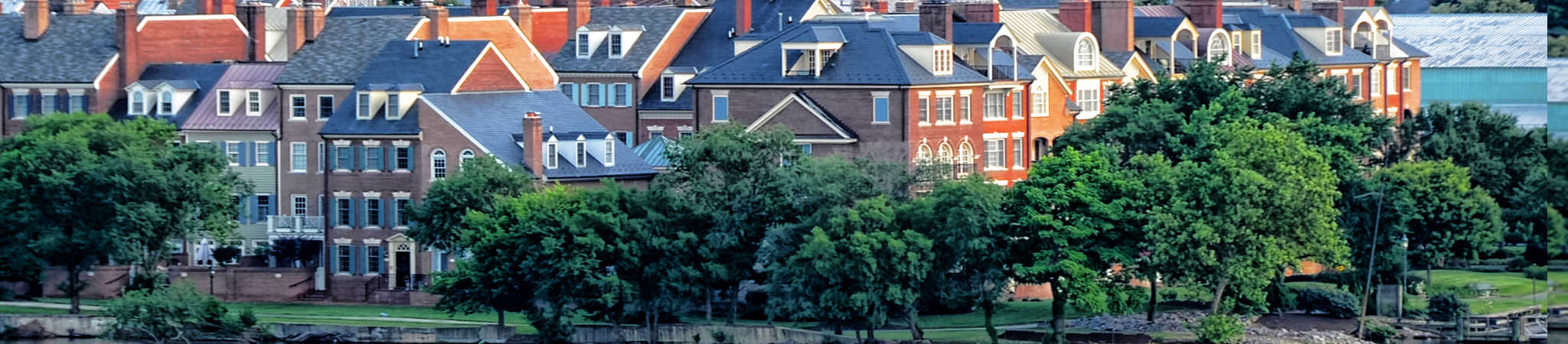 Houses are shown in the distance. The photograph symbolizes real estate law.